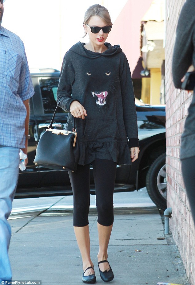 Reow! Taylor Swift channeled her inner kitty with a panther printed on the front of her sweatshirt as she headed to a Los Angeles dance studio on Saturday