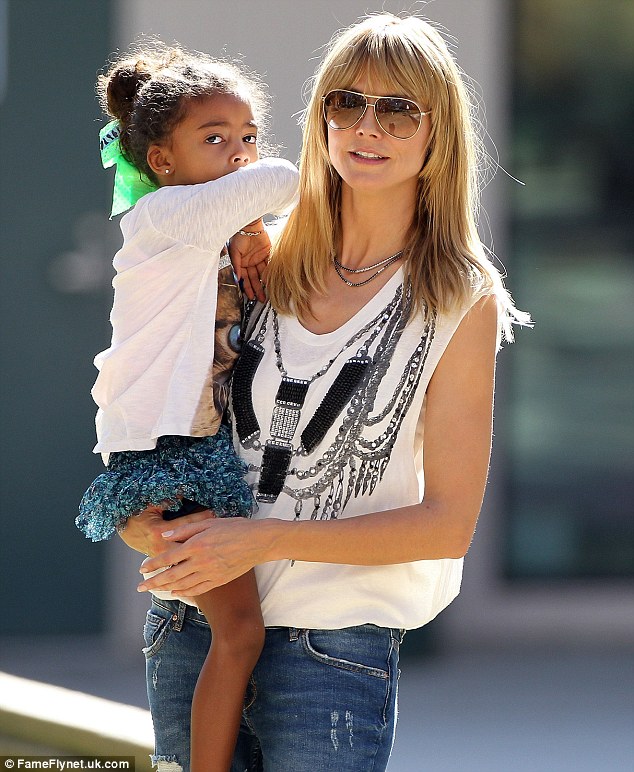 Happy mama: The 40-year-old supermodel carried her daughter Lou through the sunny LA day