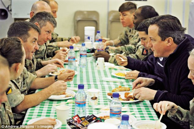 Talent: Cameron, seen eating breakfast at Camp Bastion, also revealed he played the drums at Eton