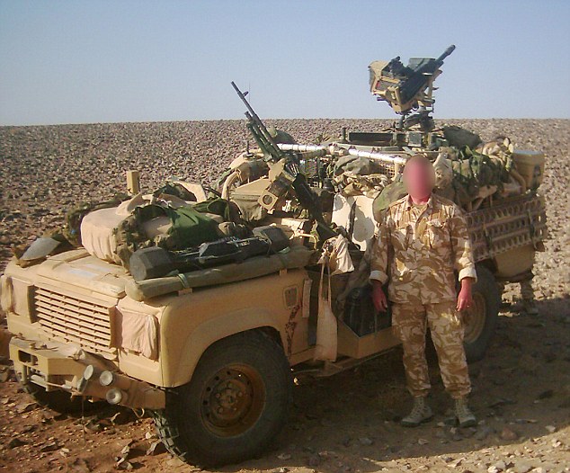 Front line: Soldier N pictured in the desert next to an SAS Land Rover during the Iraq War in 2003