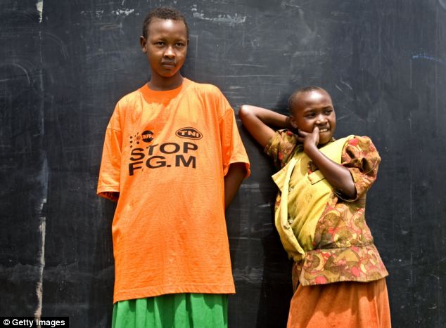 Protest: An 11-year-old girl protests against FGM outside the Tasaru Safehouse for Girls in Narok, Kenya