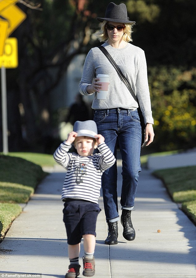 We match! January held her coffee as Xander ran on ahead wearing a matching hat to his mum