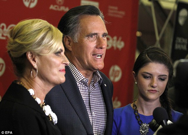 Mitt and Ann Romney along with their granddaughter Allie Romney, right, talks to the press before the premiere of 'Mitt.' After the screening, Romney declined to offer his opinion of the film