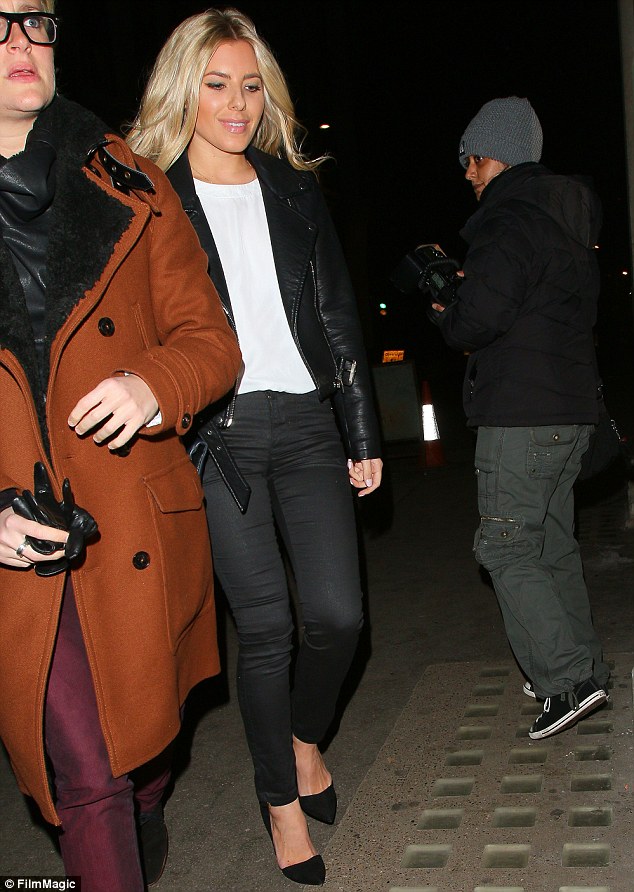 Dressed to impress: The singer looked great in a black leather biker jacket, skinny jeans and a loose-fitting white tee