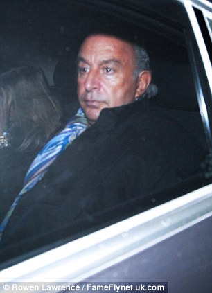 Here he comes: Sir Philip Green makes his way out of the event on Saturday evening