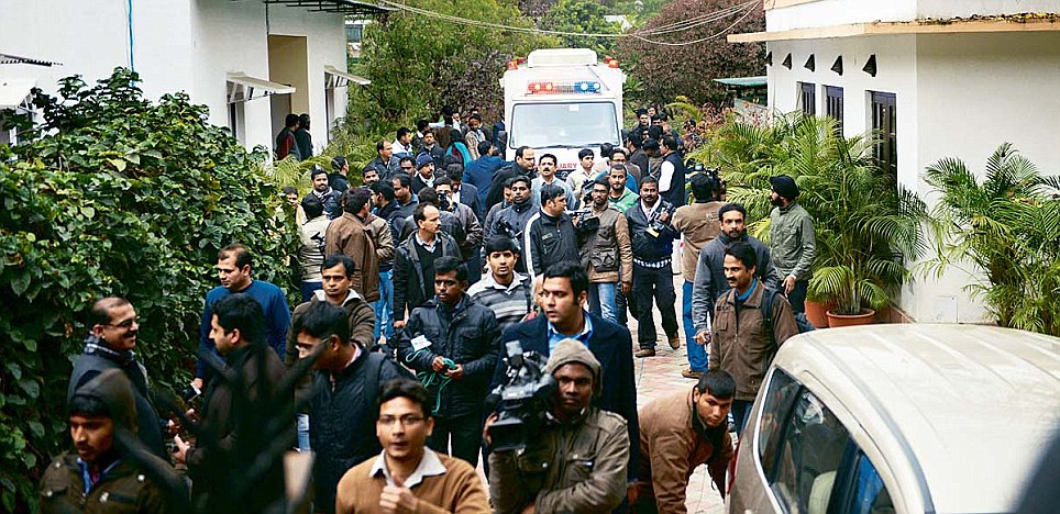 An
ambulance and representatives of the media
outside the
Tharoors' residence