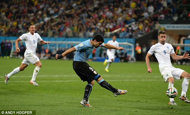 Agony: An England fan was attacked during the World Cup clash, which Uruguay won 2-1