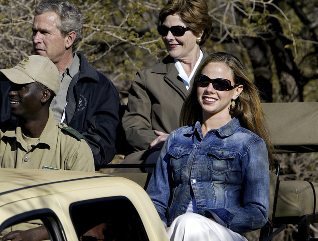 FILE - In this July 10, 2003 file photo, Barbara Bush, right, rides with her parents, U.S. President George W. Bush and first lady Laura Bush, as they tour t...