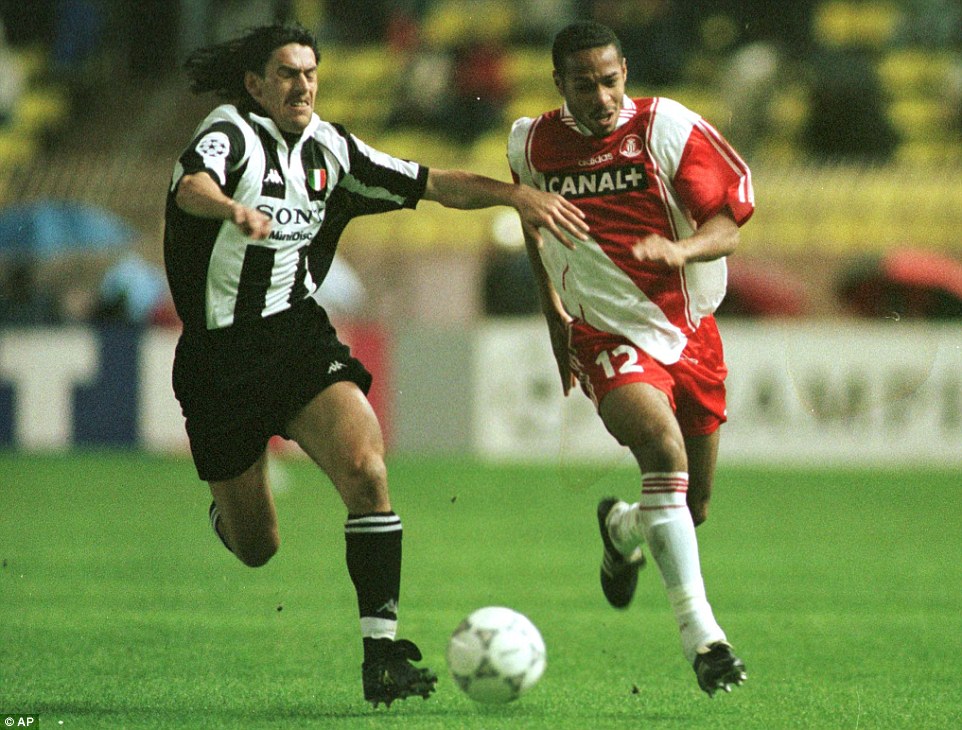 Henry in action for Monaco, his first club, against Moreno Torricelli of Juventus in a 1998 Champions League semi-final, second leg