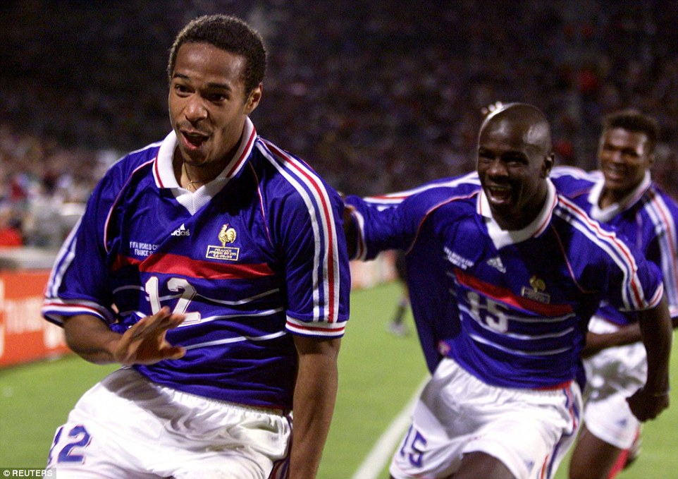 Lilian Thuram and Marcel Desailly rush to join in the celebrations after Henry's goal in the match against South Africa