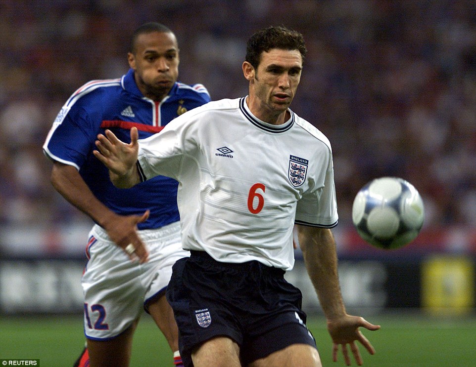 Henry chasing down England's Martin Keown during a September 2000 friendly match at the Stade de France in Paris