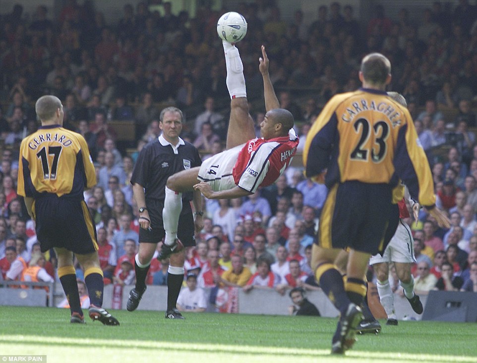 The Frenchman attempts a spectacular overhead kick in the 2001 FA Cup final with Liverpool - Arsenal lost the match 2-1 