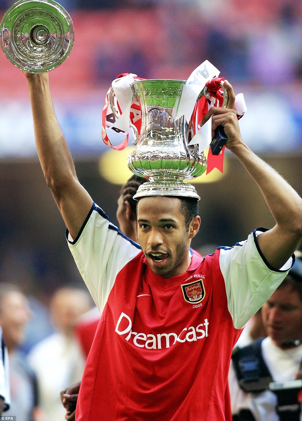 Posing with the FA Cup after Arsenal beat Chelsea 2-0 to win the Cardiff final in 2002. Ray Parlour and Freddie Ljungberg were on target