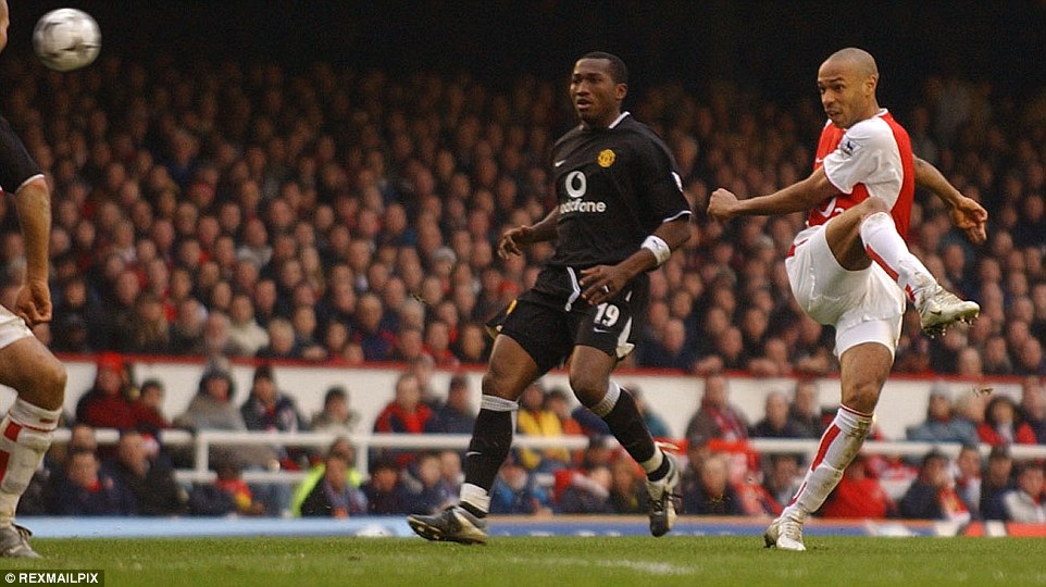 Eric Djemba-Djemba can only look on in amazement as Henry unleashes a blockbuster against Manchester United 