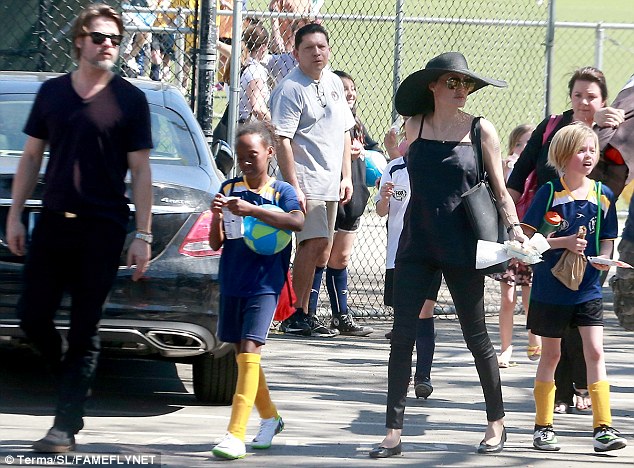 Happy family: Brad, Zahara, Angelina and Shiloh - pictured from left to right - certainly seemed to be satisfied with the results of the match