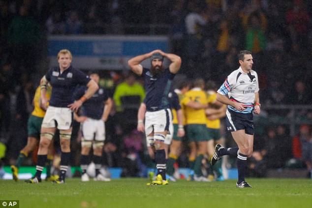 Craig Joubert (right) sprints off the pitch just moments after blowing the final whistle at Twickenham 