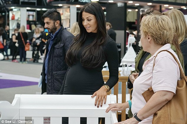 Bumping along nicely: Cara Kilbey proudly unveiled her blossoming baby bump in a black bodycon dress as she appeared at The Baby Show at Olympia in London on Friday