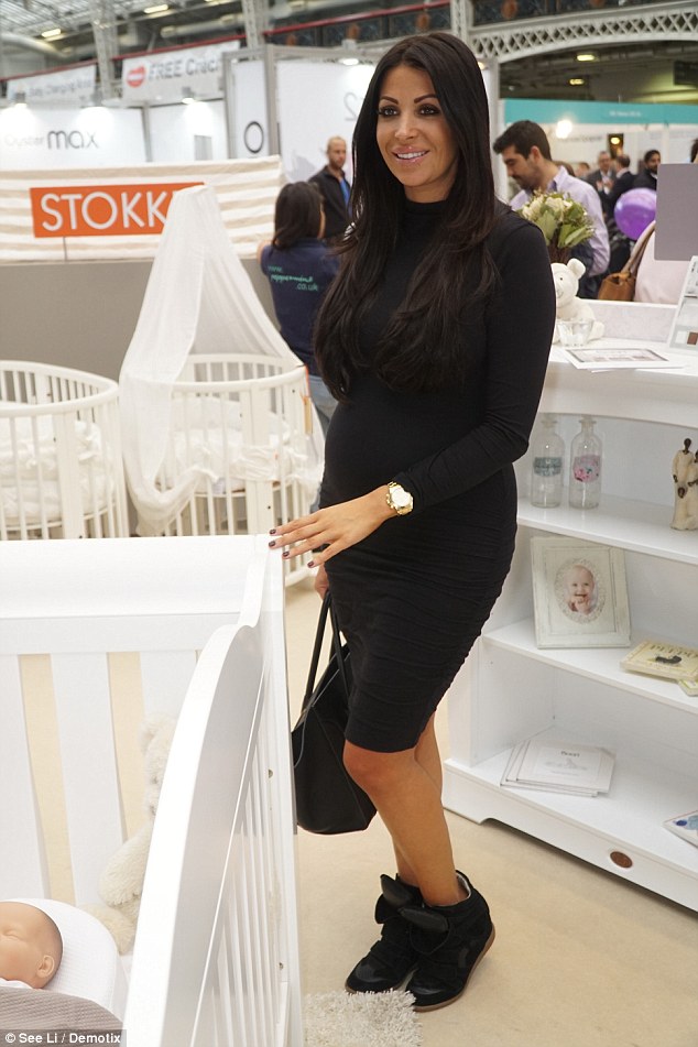 Pregnancy glow: Cara - who is best known for her short stint on the Essex-based ITVBe reality series from 2011-2012 - cut a radiant figure as she browsed the stands in search for the perfect cot for her unborn baby