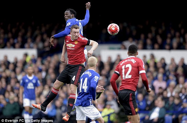 United centre back Phil Jones keeps his eye on the ball whilst heading a clearance at Goodison Park