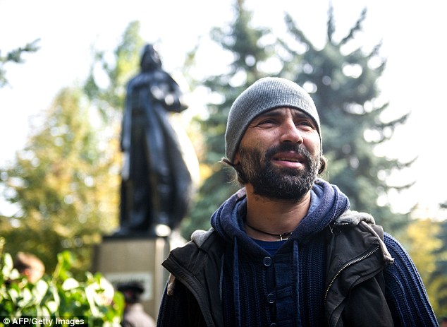 Oleksandr Milov, a sculptor from Odessa, attends the inauguration ceremony of a Darth Vader monument. He is happy with the remodelling, which emits wi-fi from its helmet