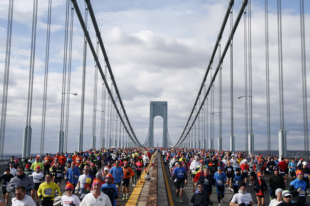 FILE - In this Nov. 2, 2014 file photo, runners cross the Verrazano-Narrows Bridge at the start of the New York City Marathon. (AP Photo/Jason DeCrow, File)