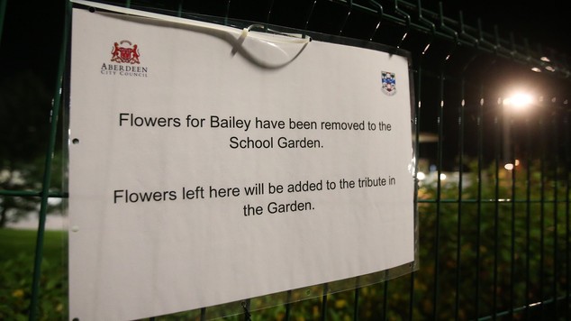 A sign on the gates of Cults Academy in Aberdeen, after most of the tributes to Bailey Gwynne were moved ahead of the school reopening