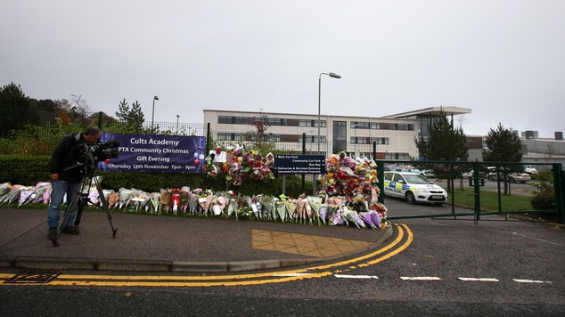 Floral tributes have been moved from the gates of the school to a private courtyard where pupils can pay their respects