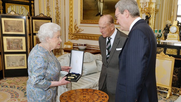 The Queen, the Duke of Edinburgh and Australian High Commissioner, Alexander Downer, as she presented Philip with the Insignia of a Knight of the Order of Au...