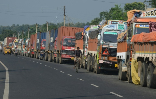 Indian trucks carrying goods to Nepal are seen parked near the India-Nepal border at Panitanki, some 40 km from Siliguri, in September 2015