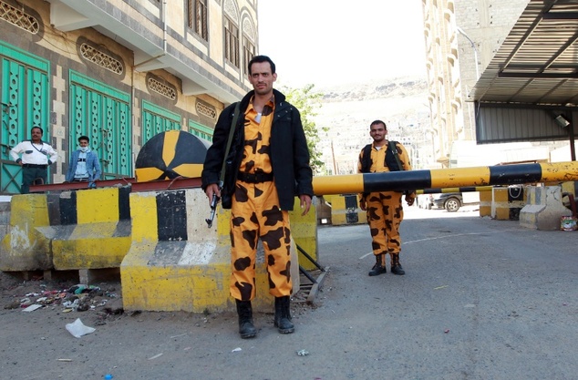 Yemeni soldiers stand guard at the entrance gate of the United Nations buildings on February 22, 2015, in the capital Sanaa