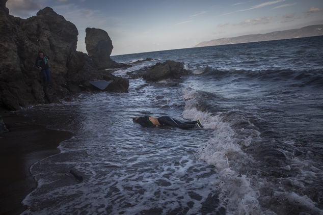 The lifeless body of an unidentified woman on a beach after washing up on the shoreline at the village of Skala, on the Greek island of Lesbos, on Sunday, No...