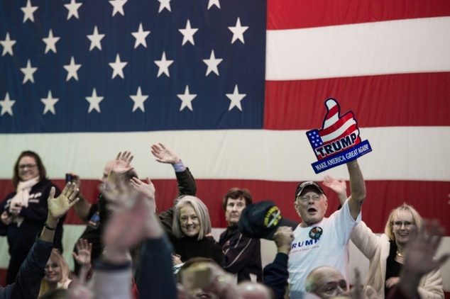 Supporters cheer as Republican presidential candidate Donald Trump speaks to the crowd on December 7, 2015, in Mt. Pleasant, South Carolina