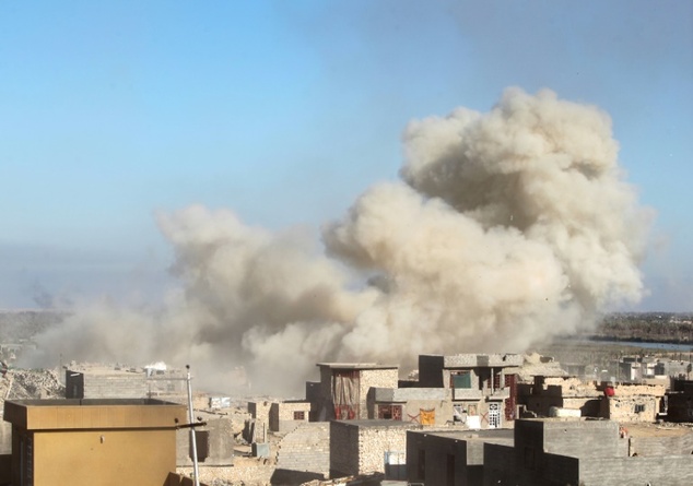 Smoke billows in the rural town of Husayba, in the Euphrates Valley seven kilometres east of Ramadi on December 7, 2015