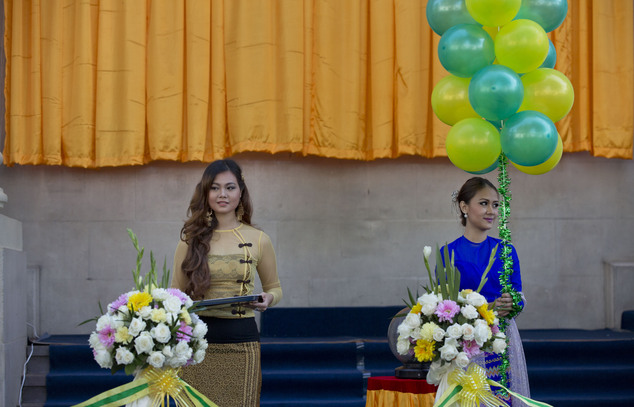 Myanmar ushers hold balloons and a tray with scissors ahead of the opening ceremony of the Yangon Stock Exchange in Yangon, Myanmar,  Wednesday, Dec. 9, 2015...