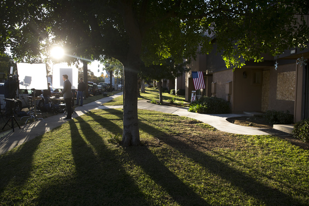 A television reporter stands in front of a townhouse rented by the San Bernardino attackers Syed Farook and his wife, Tashfeen Malik, Tuesday, Dec. 8, 2015, ...