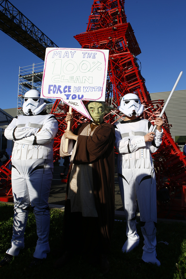 Global citizen's movement Avaaz in a Star Wars themed stunt with Yoda and two storm-troopers pose during a protest for Paris climate agreement to put the wor...