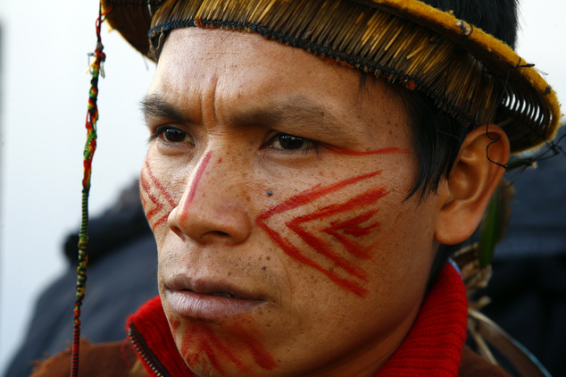 A man, no name given, listens to Chief Bill Erasmus of the Dene nation, Northern Canada delivering a statement on the emergency of global warning political r...