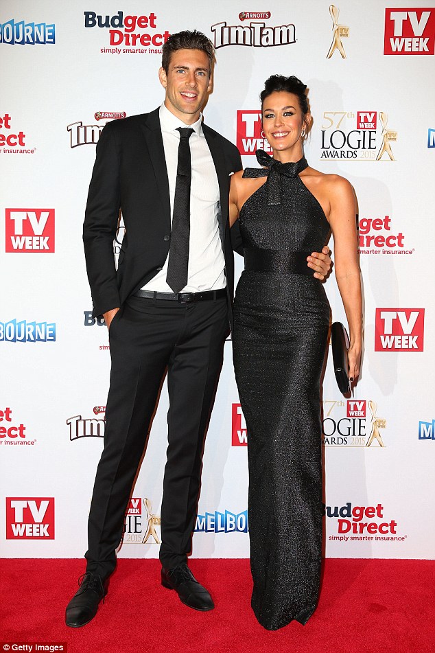 Cute couple: Now, Megan Gale, who has a two-year-old son River with AFL player boyfriend Shaun Hampson, has opened up about how she is not still hung up on losing the role of a lifetime