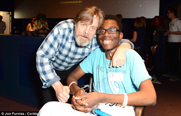 Hospital visit: Mark gave patient Benjamin Tshibaugu a hug