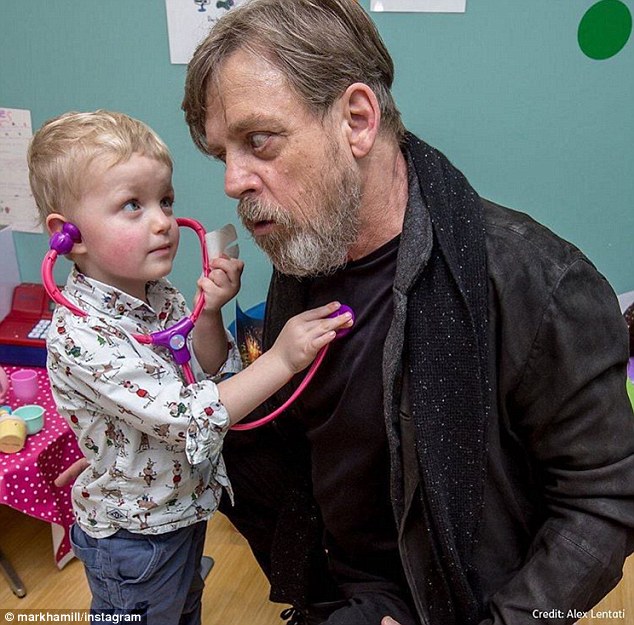 Jedi Knight in shining armour: Mark Hamill made a visit to patients at a hospital in London, U.K., on Wednesday