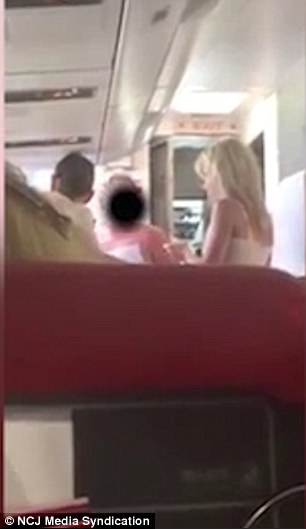 Rowdy: This is the moment a drunk Geordie woman was handcuffed and marched off a plane