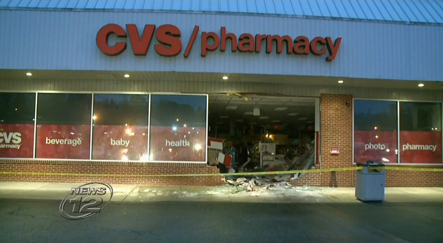 In this May 3, 2016 frame from video, police tape blocks off a CVS pharmacy after a vehicle went through it in Yorktown Heights, N.Y. Authorities say multipl...