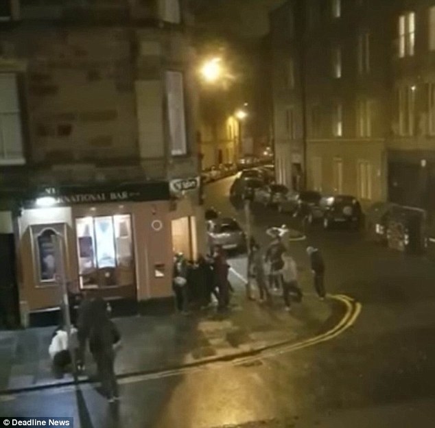 A large-scale brawl then breaks out, as fighting spills out around the pavement near the pub as men are kicked and punched in the head