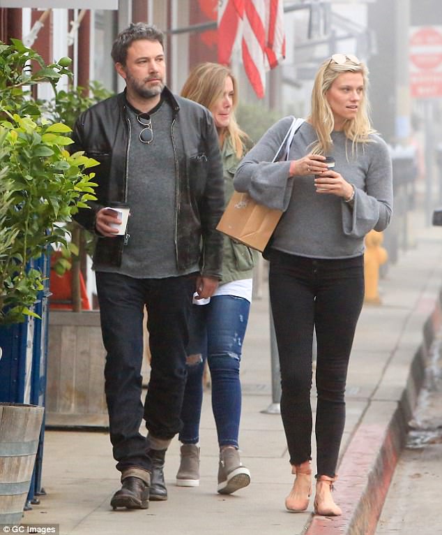 Coffee date: Ben looked relaxed as he faced the misty day with Lindsay by his side