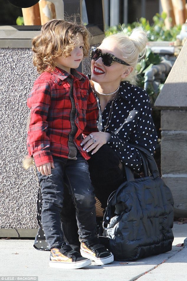 Mommy duties: The platinum blonde songstress accessorized her look with a silver necklace, multiple rings, and an oversize black Chanel handbag