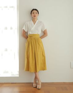 This skirt is a waist skirt with large pockets on both sides.   * 3colors - Mustard & Navyblue & Khaki   * Wrap design waist skirt   * Beautiful Linen design fabric material   * Try match with any other item that you have, they will look great together!   ▶Size    - For the detailed size, please refer to the table in the side menu attached with the picture. ▶Materials  - For more information on the mixing ratio of textiles, please refer to the table in the side menu attached with the picture. ▶M Long Skirt Pattern Sewing, Wrap Circle Skirt, Culotte Skirt, Wrap Skirt Diy, Hanbok Skirt, Linen Wrap Skirt, Linen Design, Modern Hanbok, Skirt High Waist