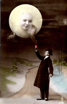 an old photo of a man holding up the moon