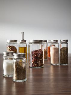 several jars filled with different types of spices