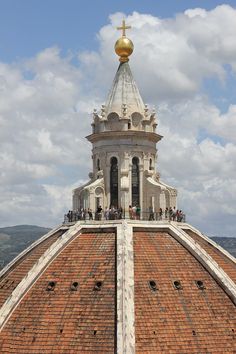 the top of a building with a cross on it