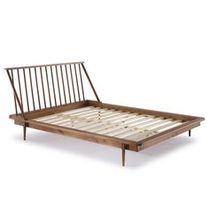 a bed frame with wooden slats on it